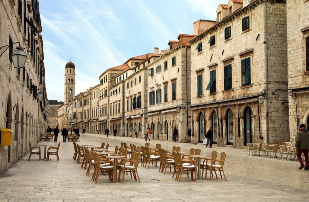 a-walk-through-the-old-dubrovnik-city-streets-strada-of-dubrovnik-the-strada-is-the-main-shopping-street-and-gathering-area-in-the-city-of-dubrovnik-in-croatia-main-street-by-early-morning-431-4875